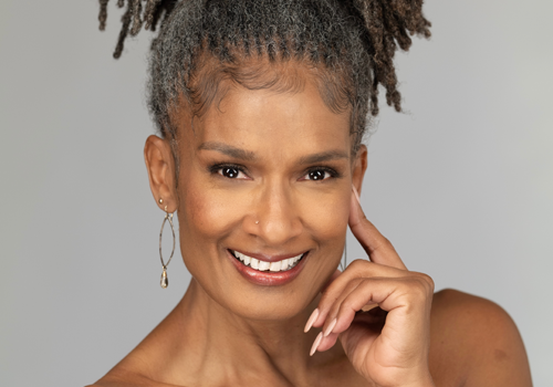 A woman smiles for the camera A woman smiles for the camera